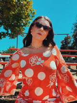 long sleeve bell sleeve orange cotton maxi dress with cream floral and polka dot print vintage 1960's