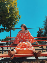 long sleeve bell sleeve orange cotton maxi dress with cream floral and polka dot print vintage 1960's