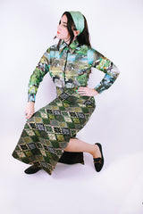 long sleeve button up bodysuit with a green print pointy collar 1970's vintage