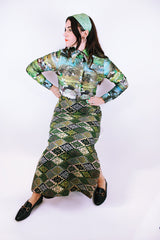 long sleeve button up bodysuit with a green print pointy collar 1970's vintage
