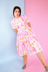 short sleeve midi length 1960's dress in white with pink and orange print