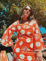 long sleeve bell sleeve orange cotton maxi dress with cream floral and polka dot print vintage 1960's