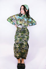 long sleeve button up bodysuit with a green print pointy collar 1970's vintage