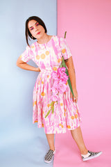 short sleeve midi length 1960's dress in white with pink and orange print