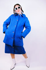long bright blue quilted puffy coat buttons up the front with collar vintage women's