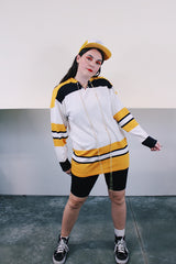 Men's vintage 1960's GC Knitting, Made in Canada label long sleeve cotton material white, yellow, and black hockey jersey with tie front neckline.