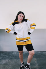 Men's vintage 1960's GC Knitting, Made in Canada label long sleeve cotton material white, yellow, and black hockey jersey with tie front neckline.