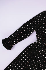 long sleeve knee length black dress with polka dots ruffle neckline and cuffs vintage 1970's
