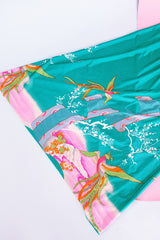 sleeveless maxi length turquoise dress with floral and bird print around hem vintage 1970's