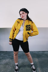 Women's vintage 1979 Nelson's Jackets, Portland, Oregon label long sleeve yellow and black wool letterman jacket. Popper buttons, patches, fully lined, knit ribbed trim.
