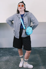 Women's vintage 1960's Pendelton label wool button up lightweight plaid jacket with big shell buttons up the front. Cream, navy, tan, and blue. Has pockets and shoulder pads.