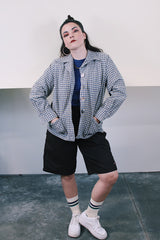 Women's vintage 1960's Pendelton label wool button up lightweight plaid jacket with big shell buttons up the front. Cream, navy, tan, and blue. Has pockets and shoulder pads.