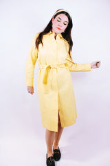 long sleeve pastel yellow vinyl shirt dress with matching tie and embroidered flowers vintage women's
