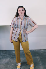 Men's vintage 1970's Towncraft JCPenney label short sleeve button up shirt with dagger collar. White with maroon, yellow, and grey vertical stripes in polyester and nylon material.