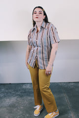 Men's vintage 1970's Towncraft JCPenney label short sleeve button up shirt with dagger collar. White with maroon, yellow, and grey vertical stripes in polyester and nylon material.