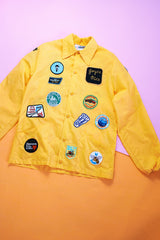 long sleeve yellow nylon windbreaker with patches all over vintage 1960's