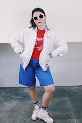 Women's or men's vintage 1960's Holloway "One shell of a jacket!", Made in USA label long sleeve white nylon zip up windbreaker with navy and red striped details.