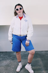 Women's or men's vintage 1960's Holloway "One shell of a jacket!", Made in USA label long sleeve white nylon zip up windbreaker with navy and red striped details.