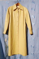 long sleeve pastel yellow vinyl shirt dress with matching tie and embroidered flowers vintage women's