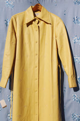 long sleeve pastel yellow vinyl shirt dress with matching tie and embroidered flowers vintage women's