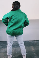 Women's or men's vintage 1970's K-Brand label long sleeve vibrant green zip up station jacket in lightweight cotton with patch on chest.