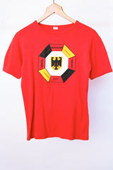 short sleeve red vintage graphic tee with germany written in various languages