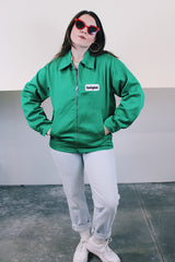 Women's or men's vintage 1970's K-Brand label long sleeve vibrant green zip up station jacket in lightweight cotton with patch on chest.