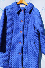 long bright blue quilted puffy coat buttons up the front with collar vintage women's