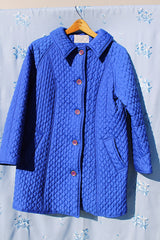 long bright blue quilted puffy coat buttons up the front with collar vintage women's