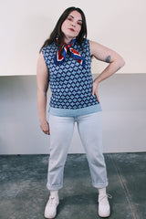 Women's or men's vintage 1970's sleeveless navy and blue printed sweater vest with ribbed trim. Soft acrylic material.