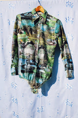 long sleeve button up bodysuit with a green print pointy collar 1970's vintage
