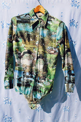 long sleeve button up bodysuit with a green print pointy collar 1970's vintage