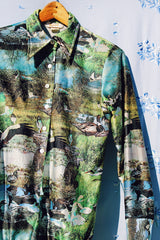 long sleeve button up bodysuit with a green print pointy collar 1970's vintage