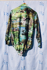 long sleeve button up bodysuit with a green print pointy collar 1970's vintage