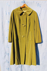 long sleeve pea green velvet tent coat with pockets and three button closure women's vintage 1950's