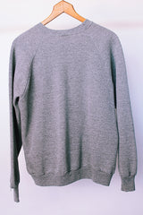 long sleeve grey crew neck sweater with cow graphic on front vintage 1980's