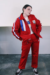 Men's vintage 1970's Swingster, World of Wearables label long sleeve red zip up jacket in nylon material with fleece and quilted liner. Popper buttons, pockets, and Cessna patch.