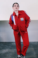 Men's vintage 1970's Swingster, World of Wearables label long sleeve red zip up jacket in nylon material with fleece and quilted liner. Popper buttons, pockets, and Cessna patch.