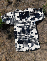 short sleeve cotton canvas mini dress cream with black abstract print buttons in the back and pockets in the front 1960's women's vintage