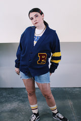 Women's or men's vintage 1970's Dehen Knitting Co., Portland, Oregon label long sleeve navy blue button up cardigan with maroon and yellow patch and stripes in acrylic material.