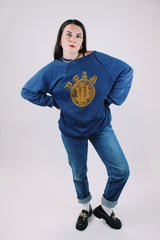 long sleeve navy crew neck sweater with yellow felt UCL logo on front vintage 1970's