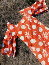 long sleeve bell sleeve orange cotton maxi dress with cream floral and polka dot print vintage 1960's