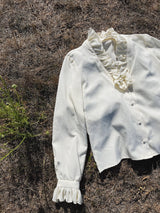 cream long sleeve blouse with ruffle trim neckline and cuffs vintage 1970's