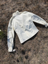 cream long sleeve blouse with ruffle trim neckline and cuffs vintage 1970's