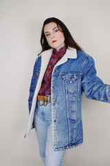 vintage 1970's Levi's San Francisco long sleeve medium wash denim jacket with a white shearling liner and a long fit