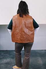 Women's or men's vintage 1980's Top label sleeveless light brown camel colored faux leather vest with four pockets, popper buttons, and zipper.