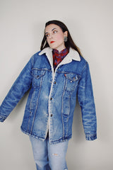 vintage 1970's Levi's San Francisco long sleeve medium wash denim jacket with a white shearling liner and a long fit