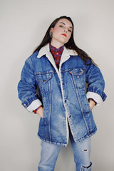 vintage 1970's Levi's San Francisco long sleeve medium wash denim jacket with a white shearling liner and a long fit