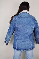 vintage 1970's Levi's San Francisco long sleeve medium wash denim jacket with a white shearling liner and a long fit