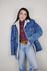 vintage 1970's Levi's San Francisco long sleeve medium wash denim jacket with a white shearling liner and a long fit